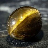 Mystical Cat's Eye gemstone with striking light band and protective energy